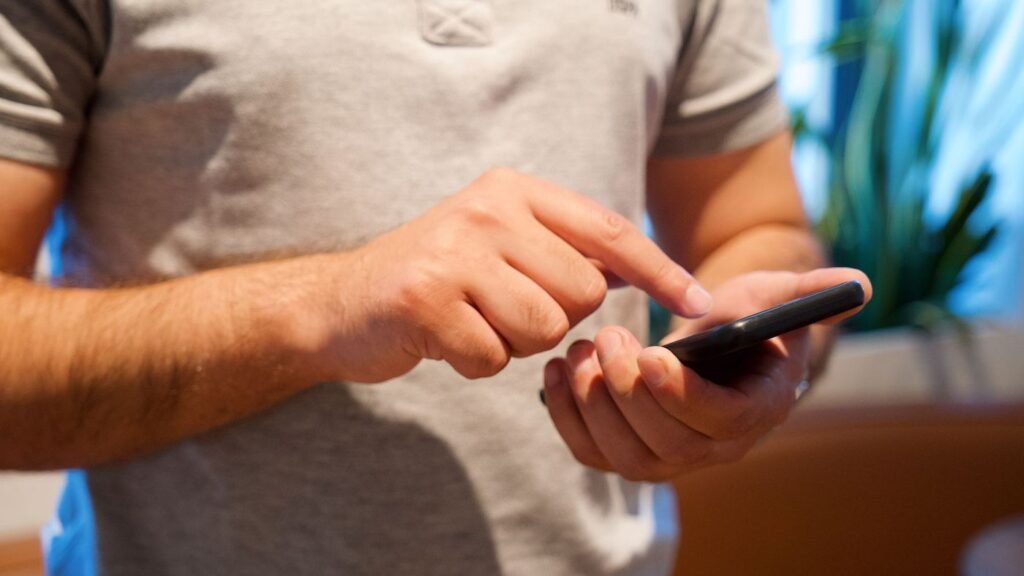 Business owner checking payments on a phone